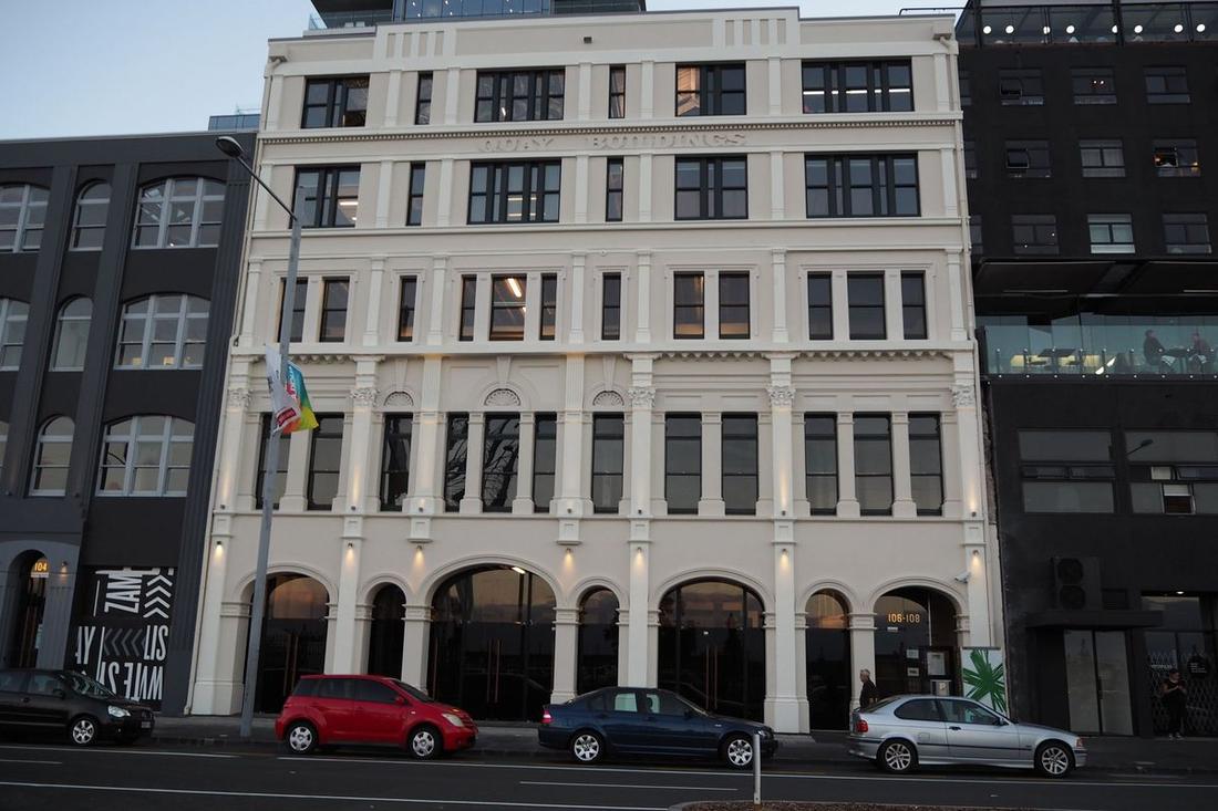 Restored historical façade of the Quay Building, showing decorative architrave details.