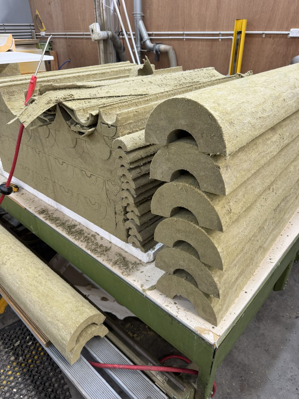Cut Rockwool pipe sections - nested half-round profiles
